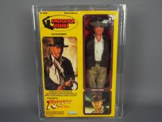 Kenner - A rare graded Kenner 1981 Raiders of the Lost Ark 'Indiana Jones' large 12" action figure.