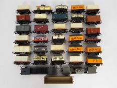 A collection of over 30 unboxed OO gauge freight rolling stock.