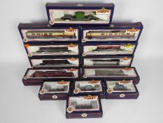 Bachmann - 13 boxed Bachmann OO gauge items of passenger and freight rolling stock.
