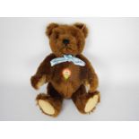 Steiff - one Steiff teddy bear - Lot includes a brown teddy bear with a white tag in its ear.