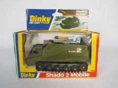 Dinky - A boxed # 353 Shado 2 Mobile with green roof, green small rollers and black tracks.