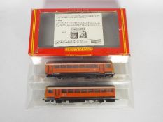 Hornby - A boxed Class 142 Pacer Twin Railbus set in Greater Manchester PTE livery. # R297.