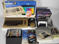 Commodore - Grandstand - A boxed vintage Commodore 64 computer with a boxed 1530 Datasette unit,