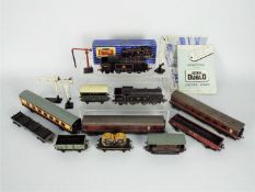 Hornby Dublo - A boxed # EDL17 0-6-2 tank engine and an unboxed 0-6-2 tank engine with 3 x coaches