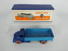 Dinky - A boxed # 532 Leyland Comet Wagon with hinged tailboard in dark blue with mid blue back and