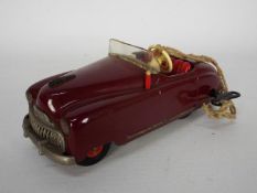 Schuco - An unboxed Schuco 4012 Clockwork Radio Car with key.