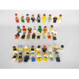 Lego - A group of 40 x loose Lego figures which appear in Good overall condition.