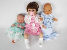 Three reborn / lifelike dolls to include a Berenguer La Newborn example, a Jesmar and similar,