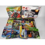 Lego - two boxes containing 40 + Lego instruction booklets with additional leaflets and related