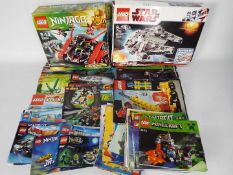 Lego - two boxes containing 40 + Lego instruction booklets with additional leaflets and related