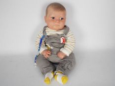 Reborn Doll - Baby boy doll with fixed blue eyes, hand painted details, magnetic mouth and dummy,