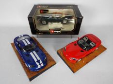 Three 1:18 scale Bburago / Burago model sports cars to include Jaguar E Cabriolet (1961),