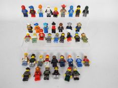 Lego - A group of 40 x loose Lego figures which appear mostly in Good condition.