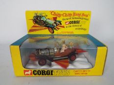 Corgi - A boxed Corgi Toys # 266 Chitty Chitty Bang Bang with front and rear wings and all four