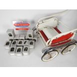 Unused retail stock - a vintage doll's pram and 4 x boxes of an excess of 200 x miniature toy