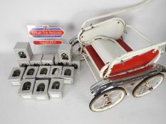 Unused retail stock - a vintage doll's pram and 4 x boxes of an excess of 200 x miniature toy
