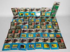 Merit - A group of 40 x carded 00 gauge railway accessories including # 5809 set of 15 x Mail Bags,
