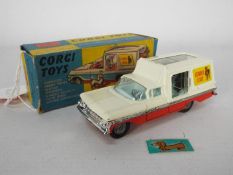 Corgi Toys - A boxed Corgi Toys #486 Kennel Service Wagon 'Chevrolet Impala' in white and orange,