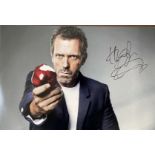ACTOR - HUGH LAURIE HAND SIGNED PHOTOGRAPH