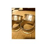 SET OF 4 WHITE METAL NAPKIN RINGS