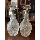 PAIR OF CUT CRYSTAL SILVER MOUNTED DECANTERS