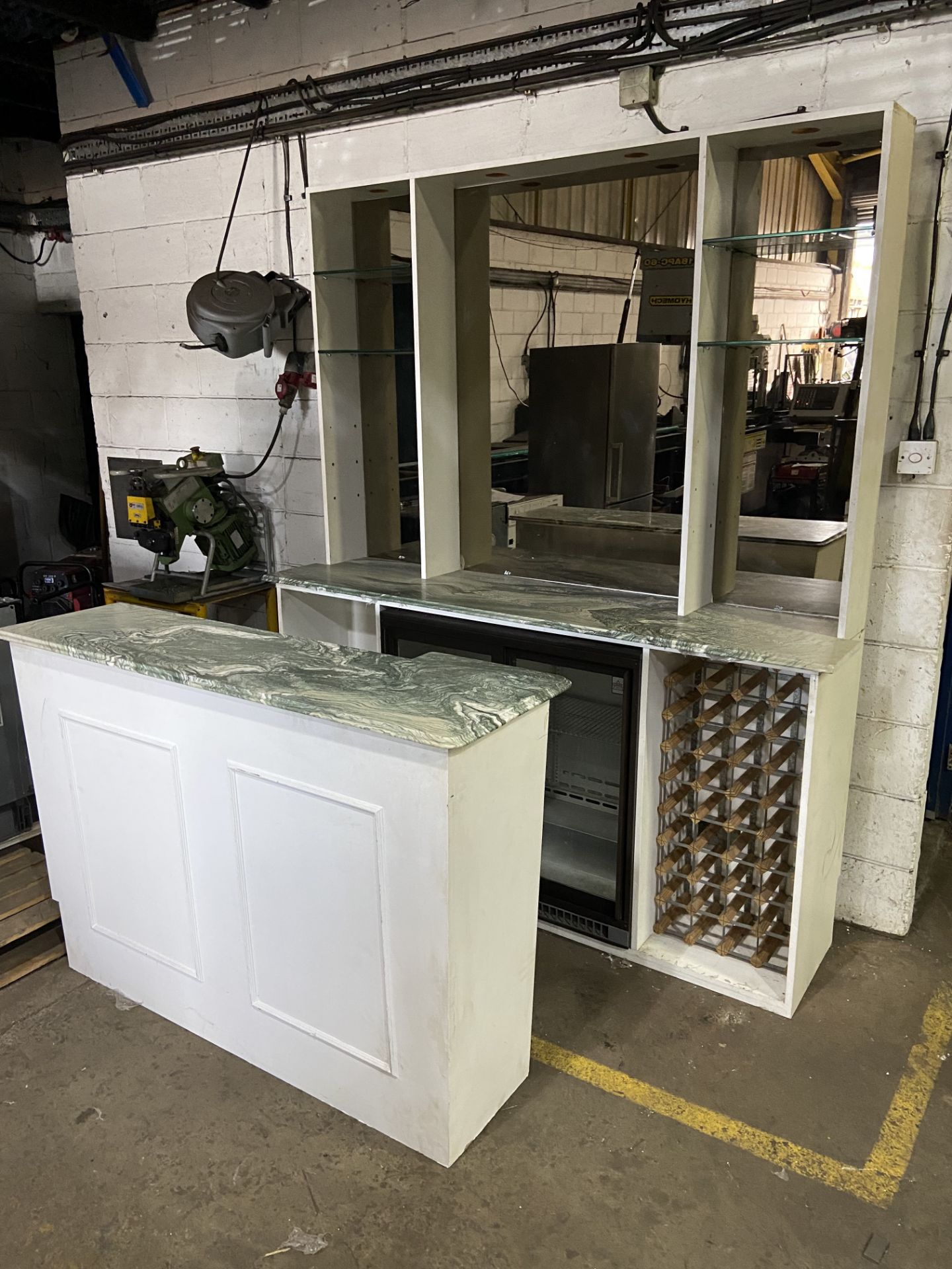 Bar with green veined Italian marble top, front and back sections with bronzed mirror back