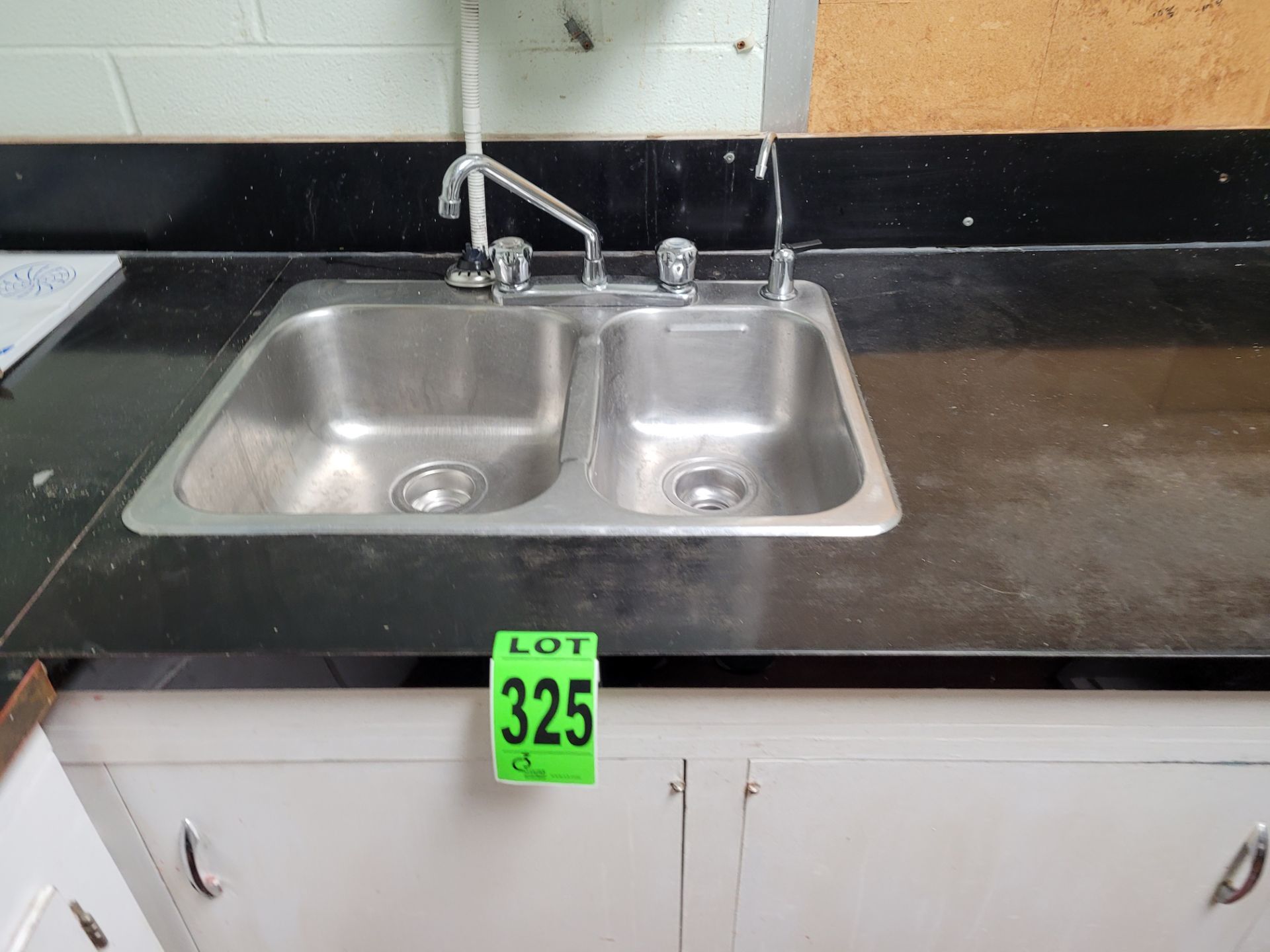 Lot of S/S Sinks and wooden cabinetry in Laboratory Area