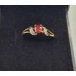 9ct Gold Stone Set Ring Having a Ruby Centre Stone with Diamonds to the Shoulders, Hallmark