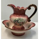 A Staffordshire water jug and matching washing bowl, nicely decorated pink/coral colour.