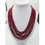 A seven row of faceted . 3-4mm ruby beads necklace. Length 44-58cm. Weight 94g