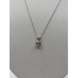 Diamond Pendant in 18ct Gold on a 9ct Gold Chain, 1.3g, 44cms.