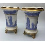 A pair of Davenport 3 footed vases, 13cm tall some age related marks (2)