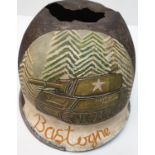 WW2 US M1 Helmet that was found in the Ardennes Forest. A post war memorial painting to ?Bastogne?