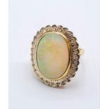 18ct gold opal and diamond ring. weight 10.3g & size M