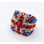 A silver (stamped 925) ring with red, blue and clear gems depicting the national flag of the