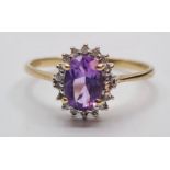 9ct Gold Amethyst and Diamond Ring. Oval Amethyst to Centre with Diamond Surround, Size P