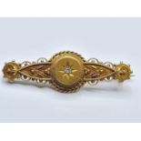 Victorian 15ct gold bar brooch with diamond centre stone, weight 3.8g and 4cm long approx