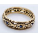9ct gold full eternity ring with clear stones and sapphires. Size O/P. 3.1g approx hallmarked inside
