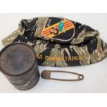 Vietnam War Era Special Forces Boonie Hat, USMC Body Bag Pin and empty M67 Hand Grenade Tube.