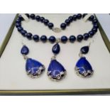 A lapis lazuli and white metal (stamped 925) necklace and matching earrings set in a presentation