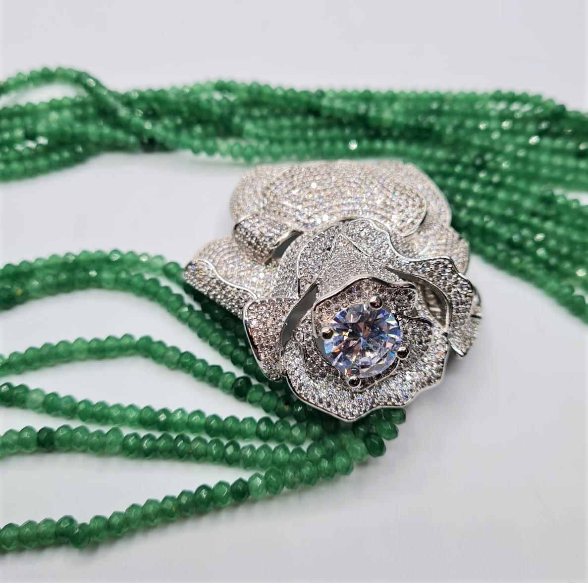 An impressive six row faceted emerald necklace with a white metal and cubic zirconia ornamental - Image 4 of 4