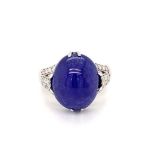 18k white gold ring with 9.11ct oval cabochon tanzanite stone and 3 rows of 0.42ct diamonds (G/I,