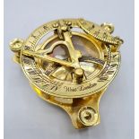 A British miniature marine sundial with compass and adjustable feet in excellent working order in