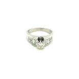 18CT W/G DIA RING. 0.40CT CENTRE DIAMOND WITH 1.20CT ON SHOULDERS OVERAL 1.60CT DIAMOND WEIGHT