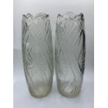 A pair of cut glass vases, 26cms tall