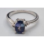 9ct White Gold Stone Set Ring Having a Blue Topaz Oval Solitaire in a Four Claw Mount. Full UK