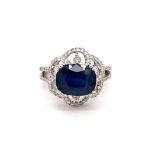 18k white gold ring with 3.25ct oval natural blue sapphire flower design halo and 2 rows of 0.69ct