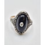 Antique diamond encrusted black enamel ring with small centre diamonds, weight 5.0g & size M