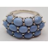 Stone Set Silver Cluster Ring Having Pale Blue/ Grey Smooth Oval Stones in a Filigree Mount, 925
