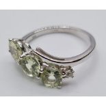 9ct White Gold Twist Ring Having a Trilogy of Pale Green Chrysoberyl Stones, Full UK Hallmark,